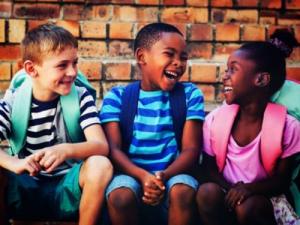 Children laugh.