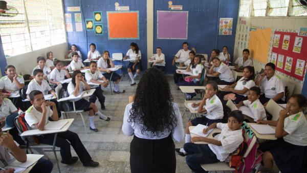 Children sit in a classroom in Honduras.