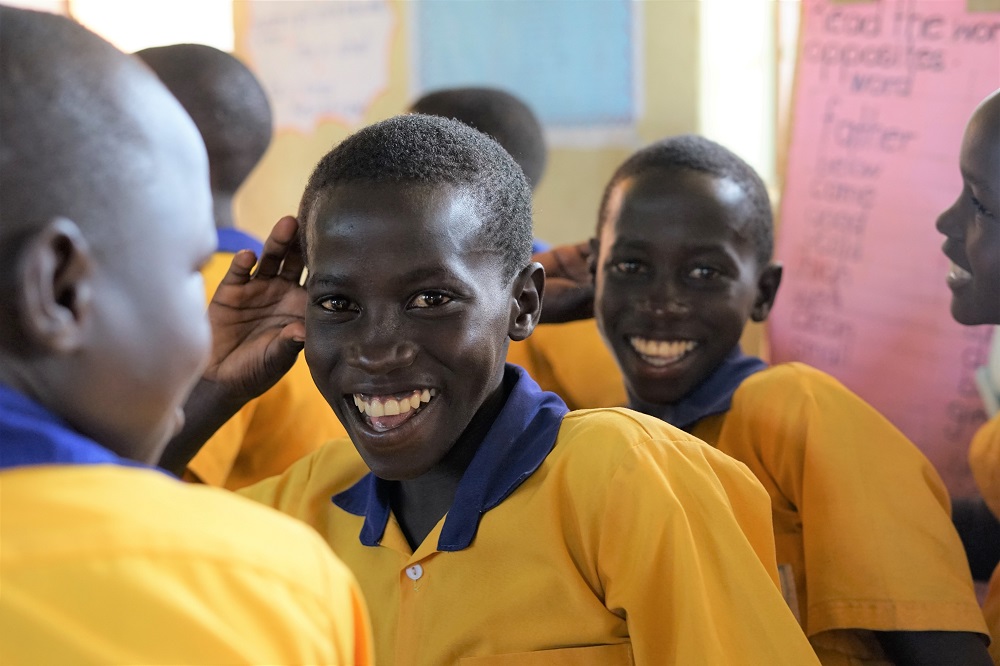 A child in Uganda smiles.