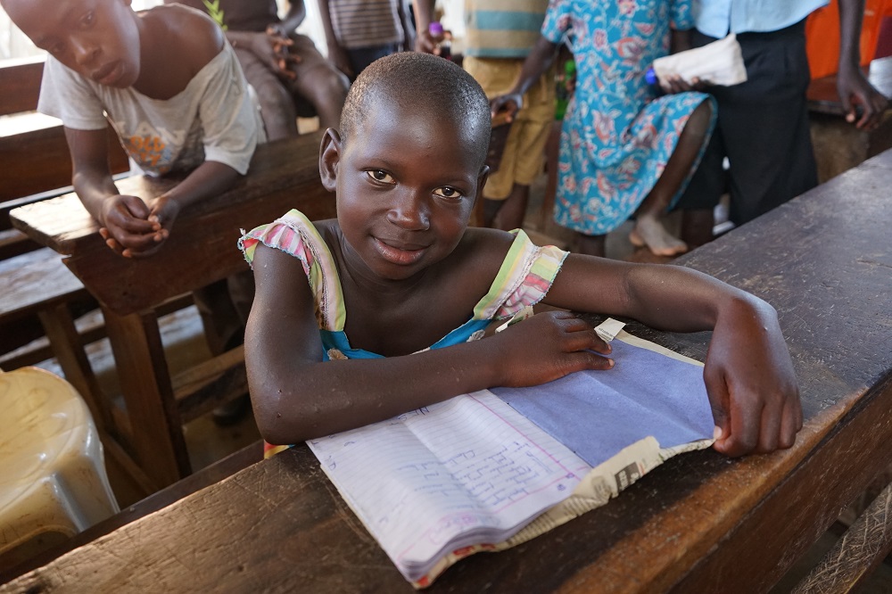 A child participates in a World Vision school-based programme at her school in central Uganda. World Vision, an End Violence partner, is working to end violence against children everywhere they are – including the classroom. 
