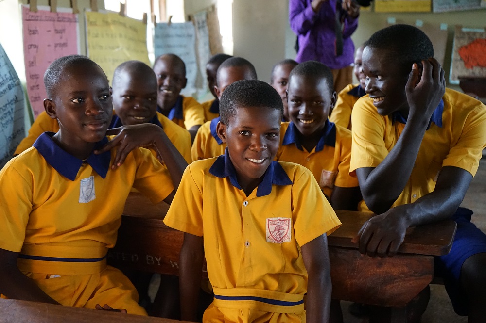 A child smiles in Uganda.