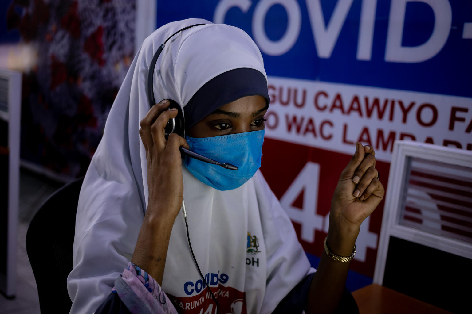 A child helpline operator talks on the phone in Somalia.