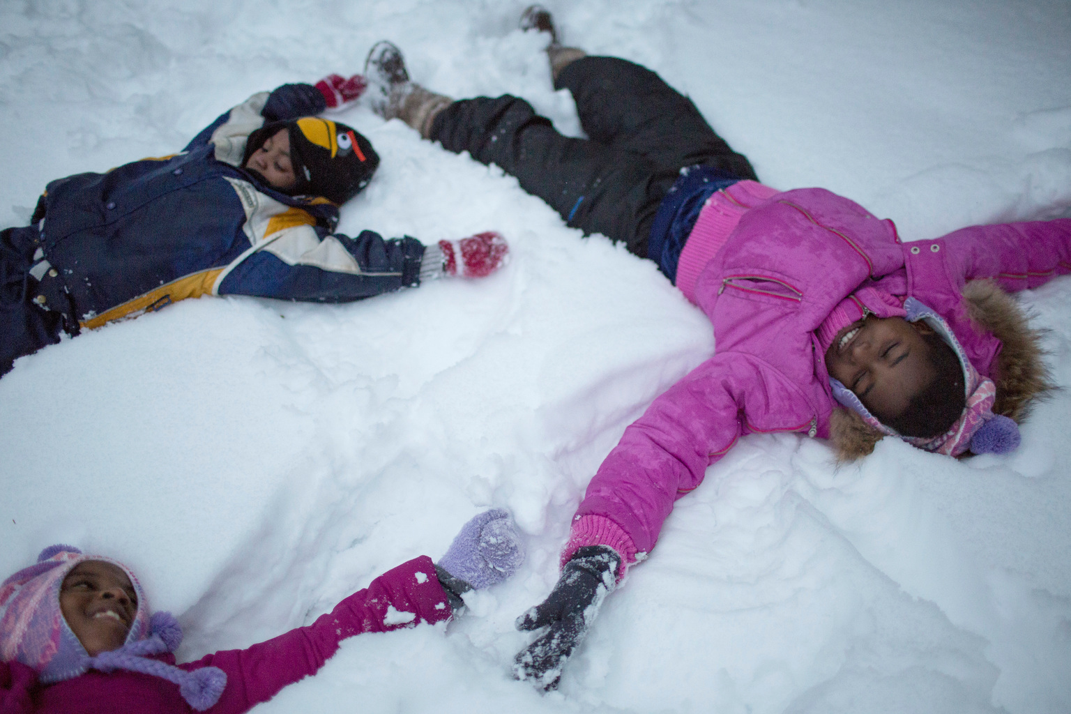 Children play in the snow in Canada.