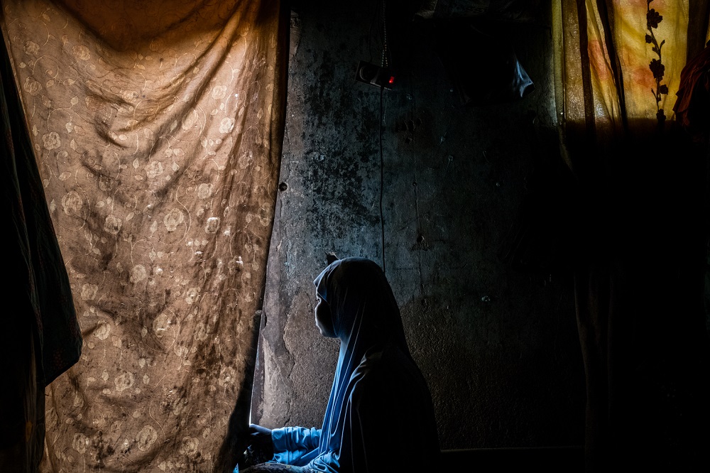 A 15-year-old girl looks off into the distance in Nigeria.