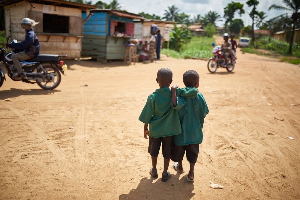 Two children in Sierra Leone go to school.