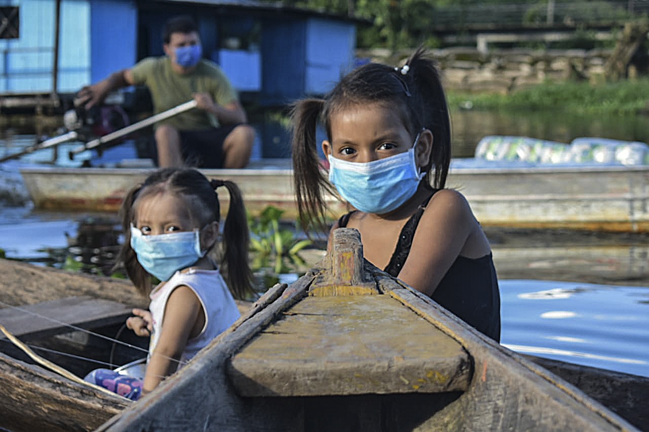 Children in Colombia wear masks.