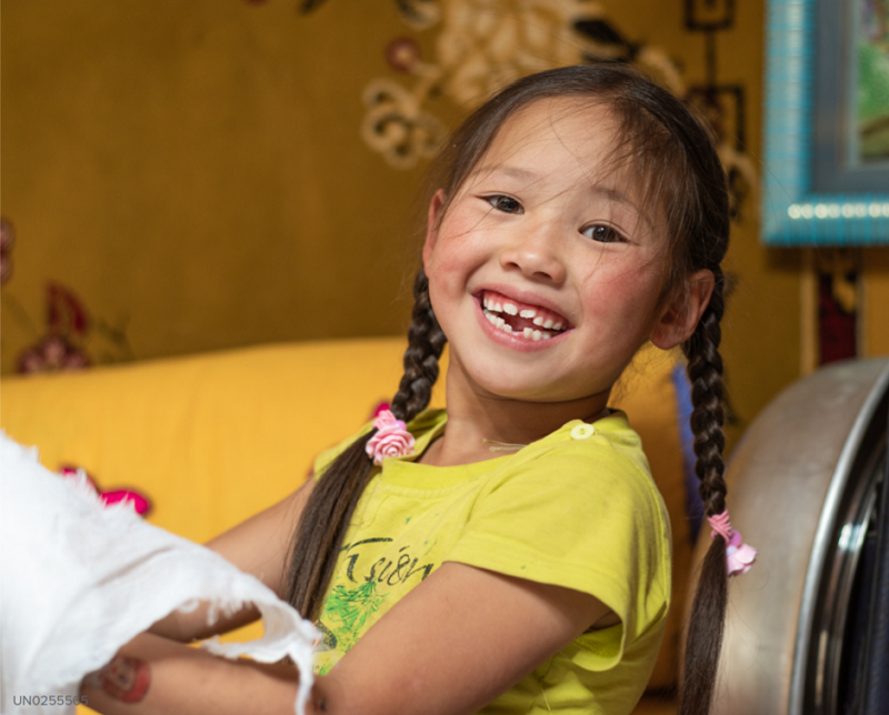 A child smiles in Mongolia.