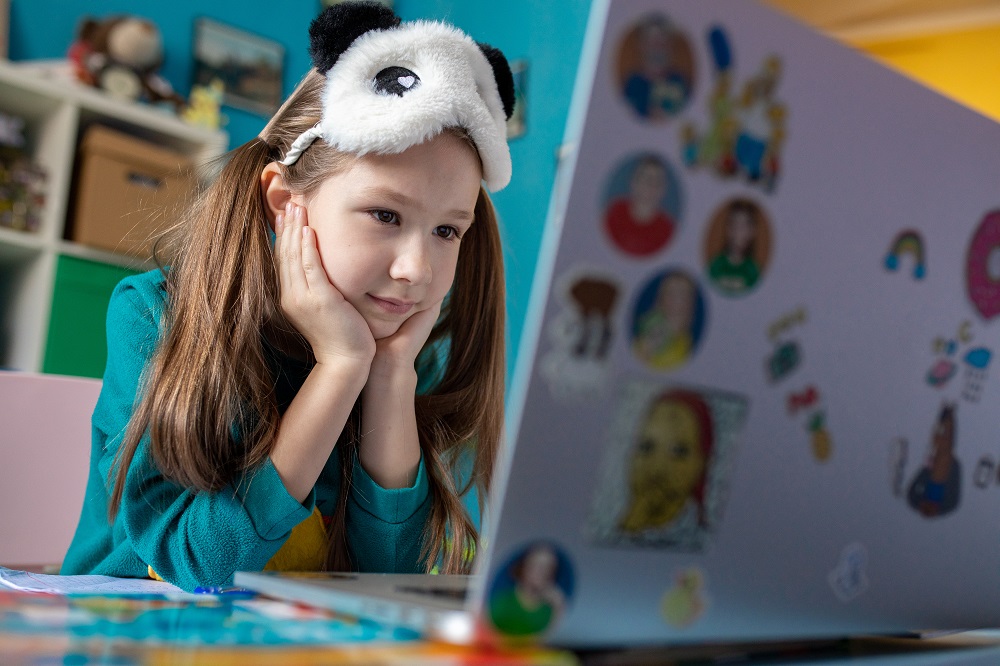 A child on her computer in Ukraine.